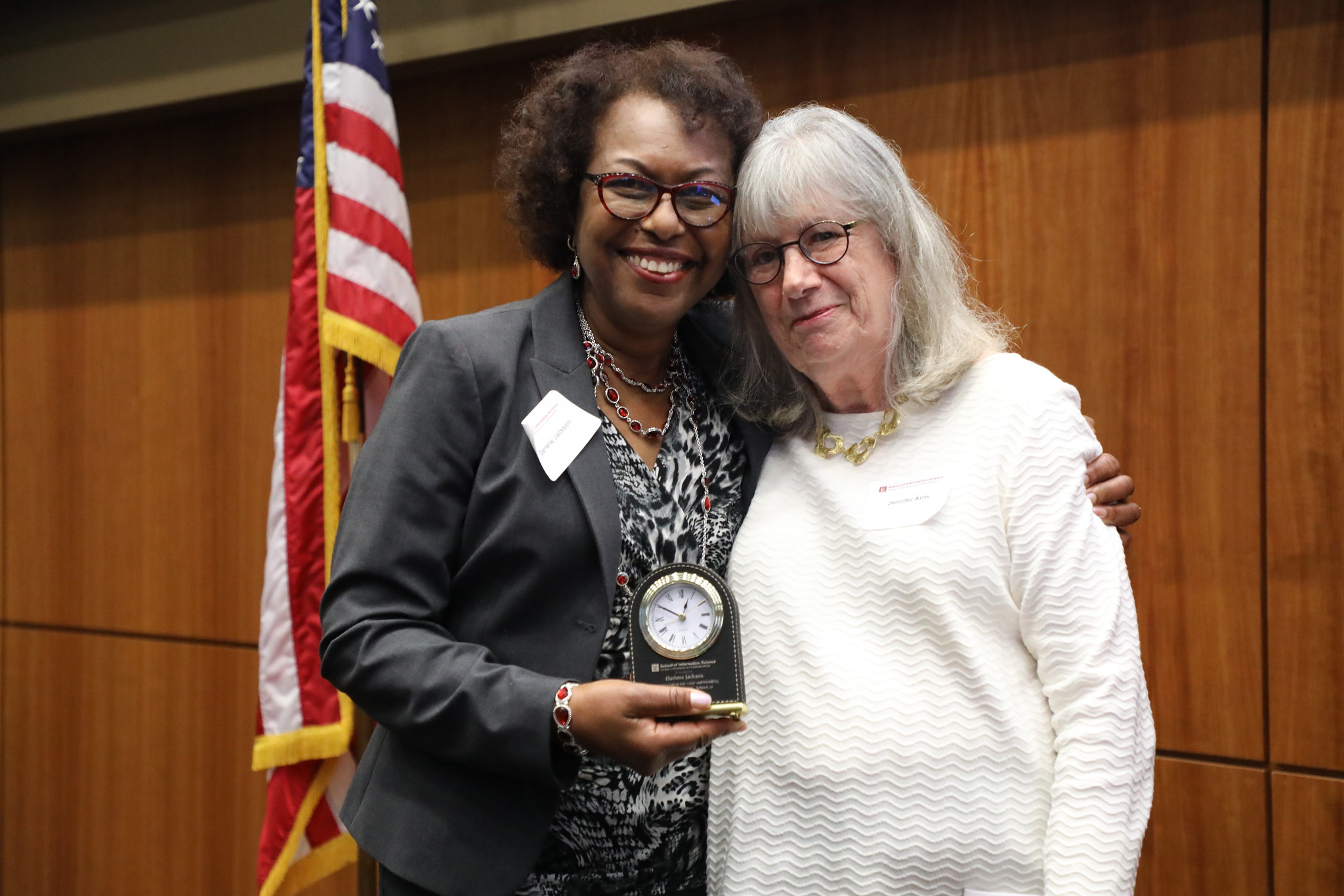 Darlene Jackson (left) is presented the Lifetime Achievement Award from Dr. Jennifer Arns with University of South Carolina's School of Information Science. 