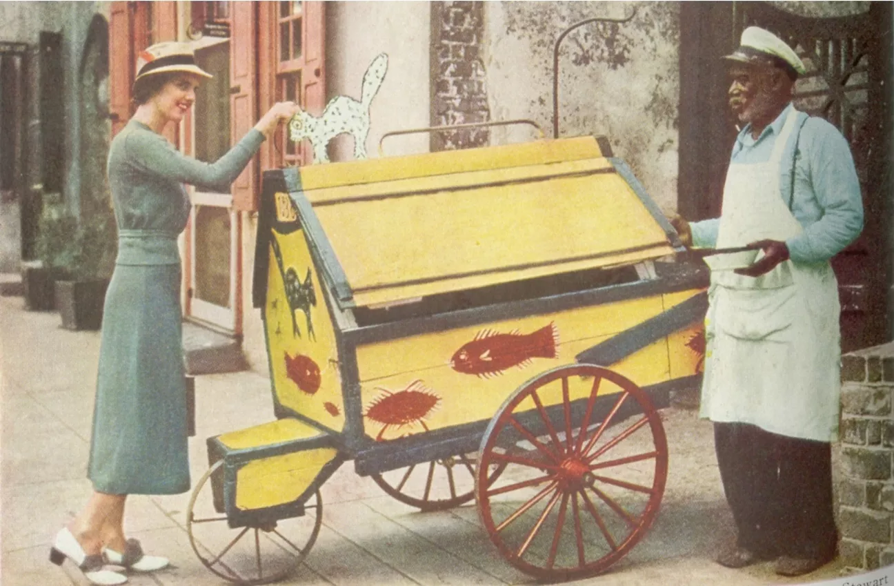 One of the images is from an old National Geographic. The man in the photo is John Wilson, voted 'Champion Huckster of Charleston' in 1938 in Charleston, as shown in National Geographic. 